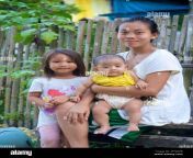 portrait of a filipino mother holding baby with young daughter camayaan loboc bohol central visayas philippines 2f70kpb.jpg from filipino mom