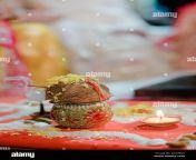 indian rituals on an auspicious day to perform pooja by placing coconut on small vase called kalashcoconutpoojawedding rituals indiantradition 2kg9b2x.jpg from ht bit do pooja and divya ki