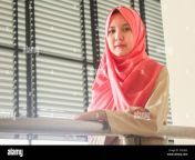 an indonesian woman posing in peach hijab veil 2h55j92.jpg from indonesian hijab