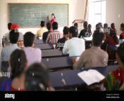 young students in university college classroom in india attending lecture with lecturer 2hkkn8c.jpg from indian collage room