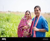 portrait shot of smiling indian village couple at meadow looking at camera concept of happy family rural lifestyle and togetherness 2ht05c2.jpg from desi village couple have some amazing sex while the camera records everything