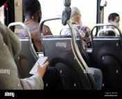 passenger using smart phone on public bus 2k2nf3h.jpg from bus pehone