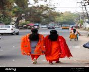 two indian women wearing red saris walking along the street in tangassery thangassery kerala india 2j85tcg.jpg from alappy kerala local ladies xxx bluefilmw bangla xnx com vintage mom xxx blue film