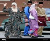 malaysian muslim model kartika sari dewi shukarno 33 left who will be caned for drinking beer waves to journalists as she leaves the islamic religious office with her family members in pekan pahang state malaysia wednesday march 3 2010 ap photolai seng sin 2ne6xha.jpg from kartika seng