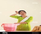 portrait of tired young woman washing clothes 2nht56b.jpg from hot desi wife washing cloth and showing her full mp4