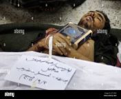 islams holy book the quran is placed on the body of yemeni anti government protestor abdou saeed mohammed who was killed during recent clashes with security at a field hospital in sanaa yemen tuesday sept 20 2011 rapidly escalating street battles between opponents of yemens regime and forces loyal to its embattled president spread to the home districts of senior government figures and other highly sensitive areas of the capital on tuesday a third day of fighting including a mortar attack on unarmed protesters killed nine people medical officials said writing in arabic reads m 2p71hf9.jpg from writing quran in body