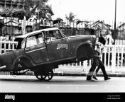 old vintage 1900s black and white picture of indian man pulling stripped fiat car on handcart bombay mumbai maharashtra india 2rdr60c.jpg from bollywood old movie police uomo scene