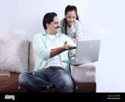 happy indian family of father mother son and daughter surfing laptop having pleasant time together joyfully family is looking into the laptop 2rarpdf.jpg from indian marati momsex all film actors mousumi sex porn vid