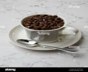 coffee beans in coffee cup 2rxkp6a.jpg from kgjmjt