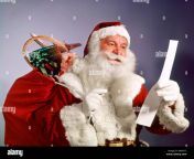 1960s santa claus reading the list of naughty nice smiling carry bag m66nt5.jpg from naughty america old to young milf rape
