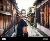 japanese woman wearing traditional dress and walking outdoors mk0f8h.jpg from the japanese wife outdoor