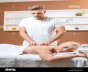 handsome male masseur doing massage to beautiful woman r5gahk.jpg from handsome massage