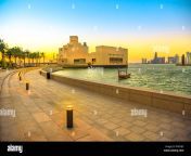 seafront walkway with palm trees along doha bay with dhow and skyscrapers of doha west bay skyline at sunset urban cityscape qatari capital in rywybc.jpg from qatari bay