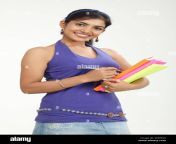 indian college girl holding books and smiling w4h393.jpg from desigirlcollege