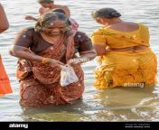 an indian hindu woman wearing a sari performs an early morning bathing ritual in the river ganges in varanasi uttar pradesh india south asia w8mym5.jpg from indian saree old aunty bathing hidden camera only bath video