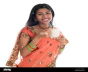 happy traditional indian woman in sari drinking soy bean milk isolated on white background wxj45n.jpg from drink desi sex hindi saree