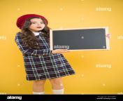 expressing surprise school shopping sales child on yellow background advertising board for promotion happy girl in french beret back to school small girl kid with school backboard copy space w1hdec.jpg from bangladesh bhola xxx school girl 14ाँव
