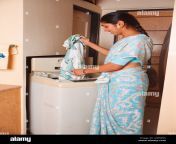 indian woman working dropping clothes into washing machine model release a3pmn6.jpg from hot desi wife washing cloth and showing her full mp4