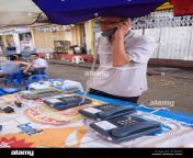 young man making telephone call from street vendor yangon myanmar a1904n.jpg from myanmar call