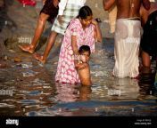 mother bathing freightened child in the ganges river in varanasi india bea22j.jpg from indian real mom son bath sexdamil