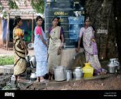 women fetch water from a freshwater tank in a village in tamil nadu bg52g9.jpg from tamil village pengal kuliyal