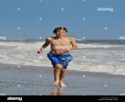young boy running at the beach on a sunny day bf4622.jpg from vintage nudist teenage boysotela bhai