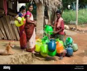 indian man selling plastic water pots to women in a rural indian village bffbt3.jpg from 114 chan hebedian village bhabhi chudai video