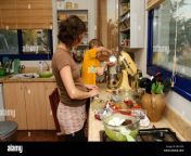 mother and son work together in the kitchen backing a cake model release bh1350.jpg from mom work in kitchen son forced sexxxx b