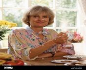 middle aged woman having cup of tea berkshire england united kingdom ceeaae.jpg from british mature lad