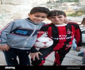 a portrait of two young jordanian arab boys posing with a soccer ball ceaemd.jpg from arab boy2