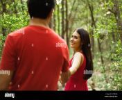 hispanic couple holding hands and walking outdoors c3rr9g.jpg from outdoor romance bengali lover