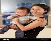 smiling korean mother holding baby d6ertg.jpg from korean mom and son hot sex