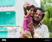 indian father and daughter waving and smiling andhra pradesh india dff58t.jpg from desi dad and daughters for