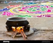 boiling water on an open fire in a rural indian village in front of dpky1c.jpg from indian village fir