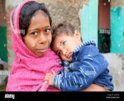 an indian baby little boy in his mothers arms in an indian village egfw05.jpg from village babey mendian