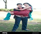 a young and happy indian man carrying his fiance who is wearing a f4t3aw.jpg from indian guy lifting a saree for romance