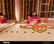 1 adult woman housewife diwali festivals home rangoli decoration fddt57.jpg from indian desi moti diwali housewife fake