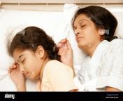 south asian indian mother and daughter having sound asleep on bed fg1t27.jpg from indian mom sleep