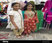bangladeshi american girls ages l to r 12 and 14 enjoy street fair f09ta0.jpg from bangla small gal