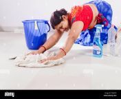 1 indian adult woman housewife cleaning floor boredom f2wgtp.jpg from aunty cleaning flo