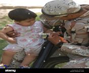 an iraqi soldier with the 6th iraqi army entertains an iraqi child hf31e2.jpg from İraqi