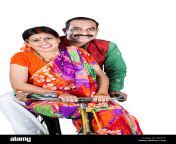 indian rural couple husband and wife riding a bicycle in white background jb672c.jpg from desi hajbed waif