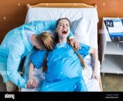 pregnant woman giving birth in hospital while man hugging her j1hn3m.jpg from pregnant delivery blue film