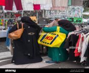 muslim women shopping for bargain clothes in the market in bologna kb7am8.jpg from burka muslim aunty moti gand
