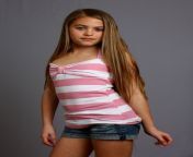 a beautiful young girl posing on a gray background.jpg from young for